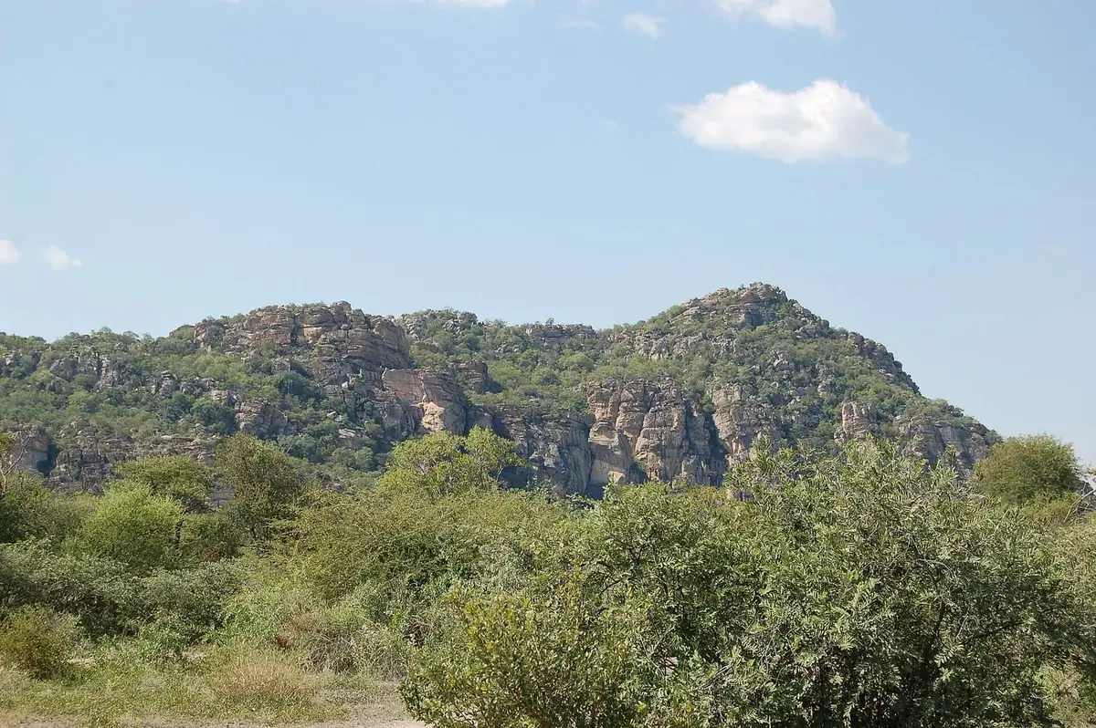 The Tsodilo Hills rising from the Kalahari sand